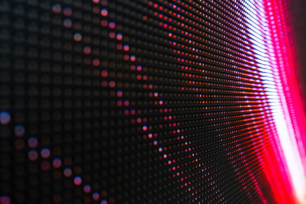 A close-up photograph of an LED board with predominantly red LEDs. The LEDs are arranged in a grid pattern on the circuit board, showcasing the red colour of the lighting elements.
