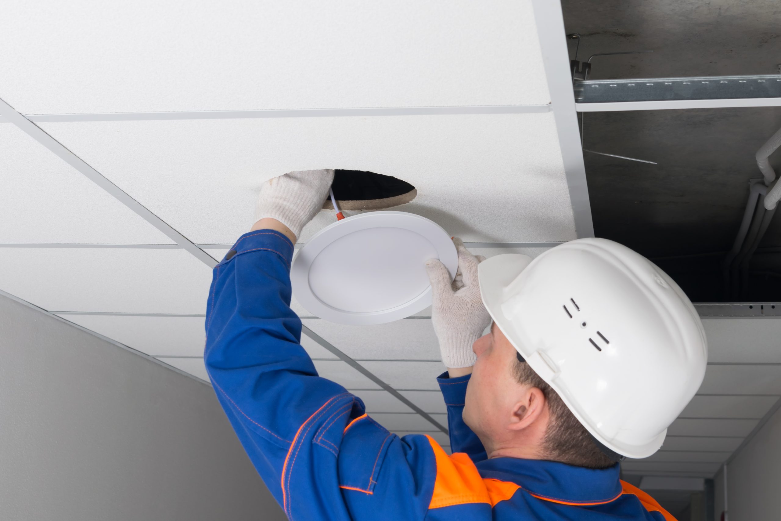 Faulty office light being replaced